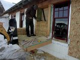 Tamping bales in place.jpg